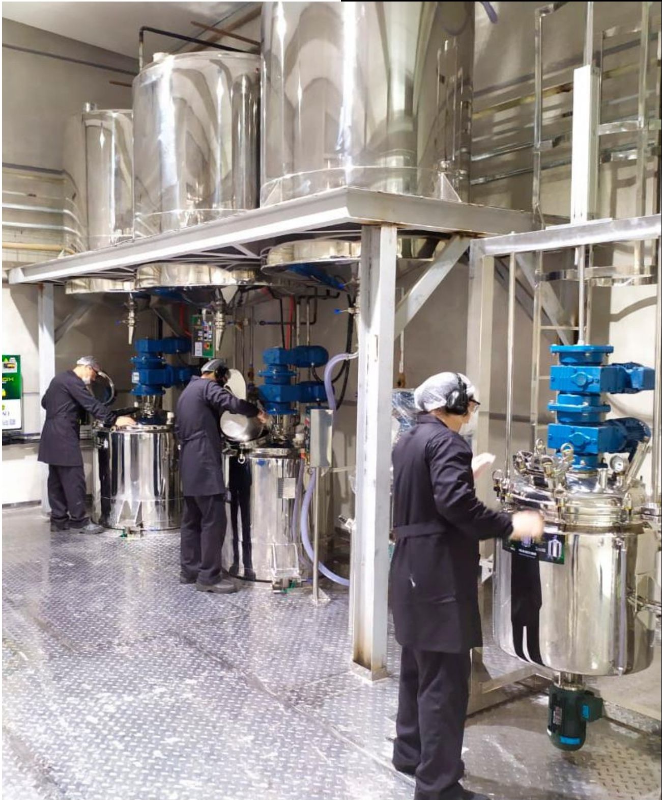 Koosmetics Group factory floor with chemists and stainless steel equipment